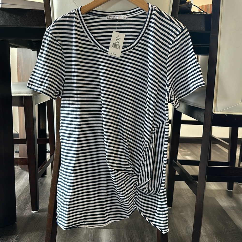 NWT women’s fun style tee with a bunched/knot look on left front. 100% cotton!